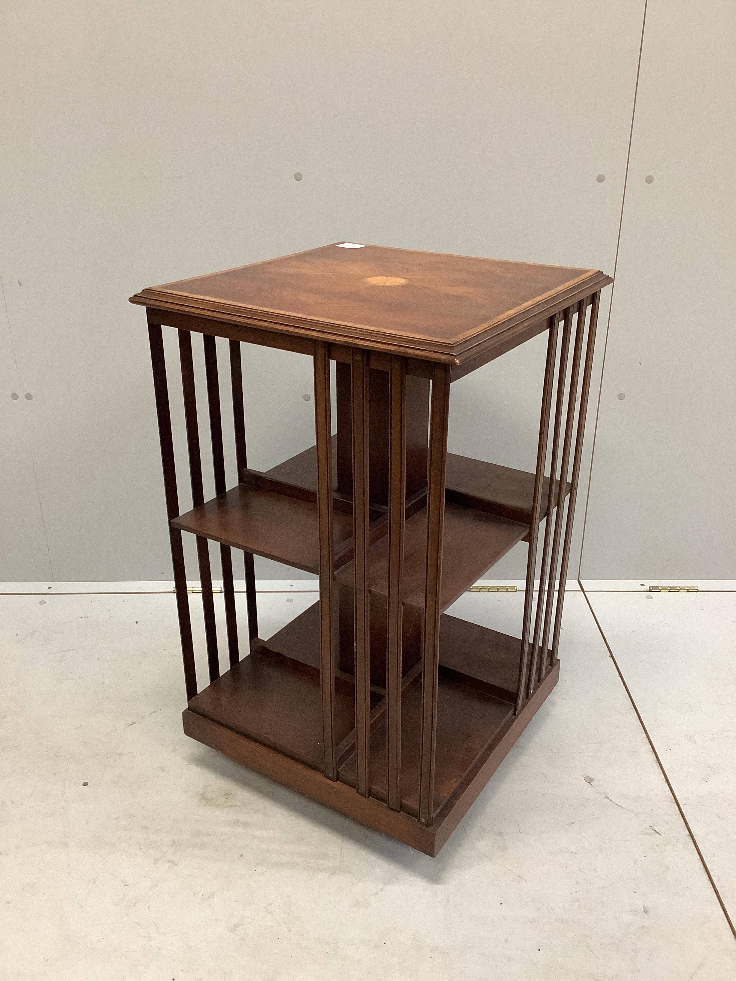 An Edwardian style inlaid mahogany revolving bookcase, width 49cm, depth 49cm, height 81cm